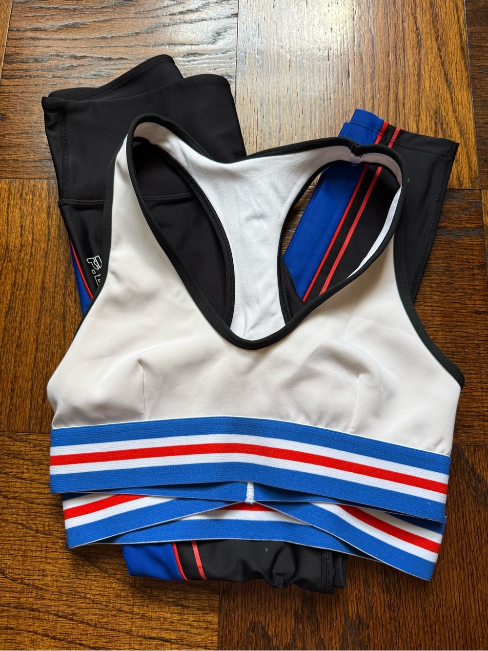 P.E Nation White Sports Bra with Blue and Red Striped Band